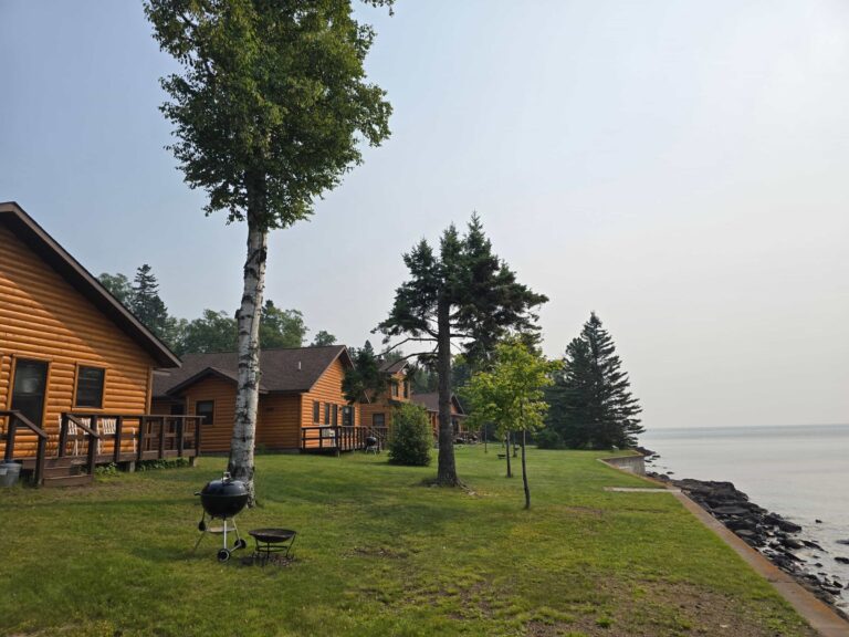 Log cabins at Ours Resort spread along 600 feet of private Lake Superior shoreline near Lutsen, Minnesota